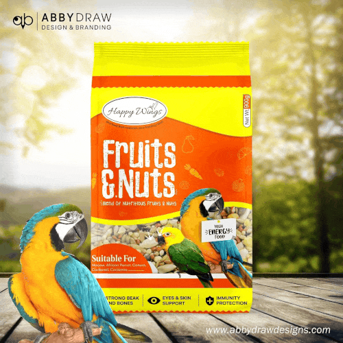 Happy Wings Fruits & Nuts bird food packaging with colorful parrots and yellow-orange design.